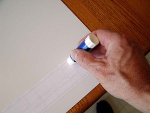Applying stick paste to the blueprint print out